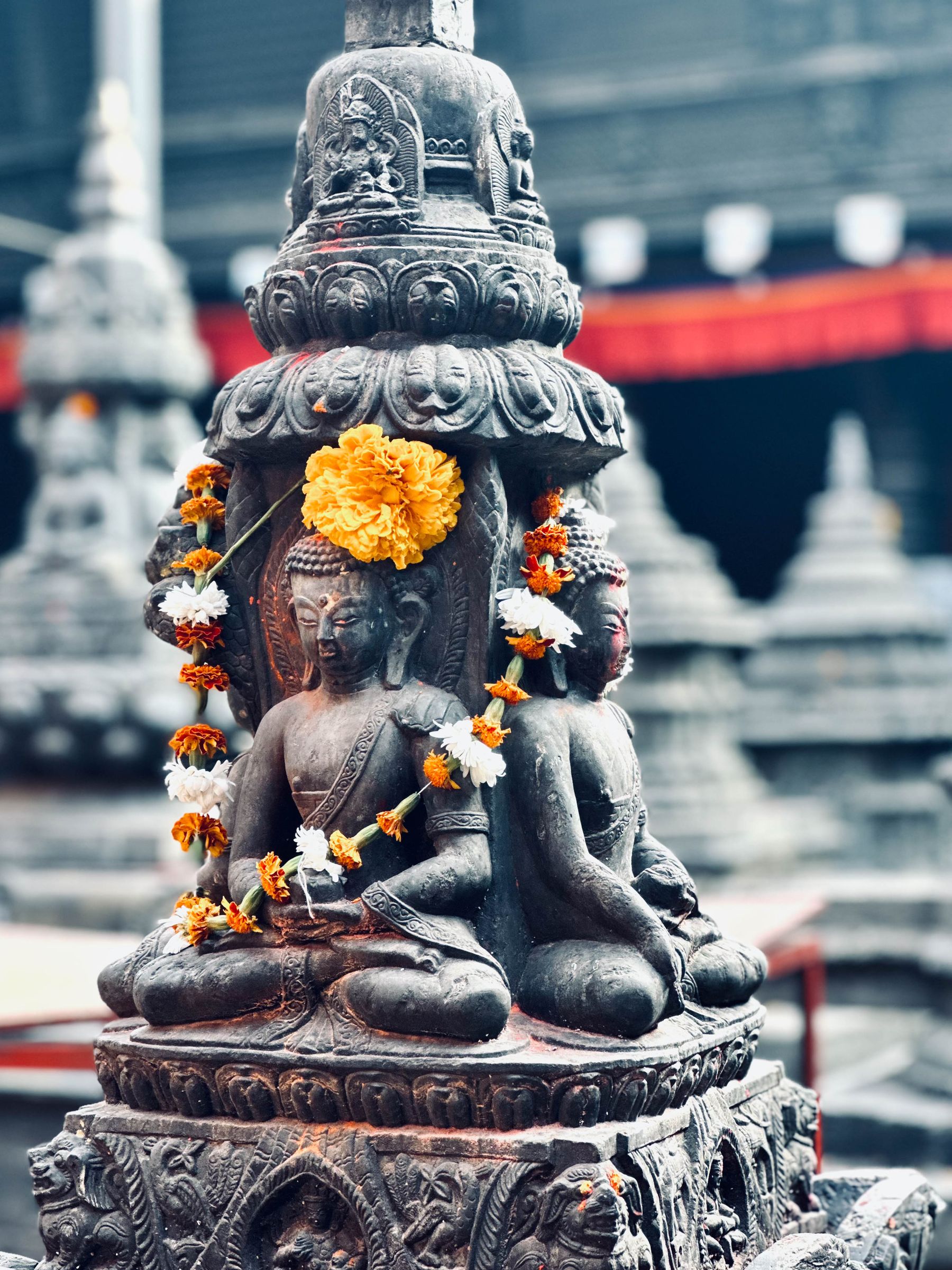 Buddha Obelisk with Marigolds for Tihar